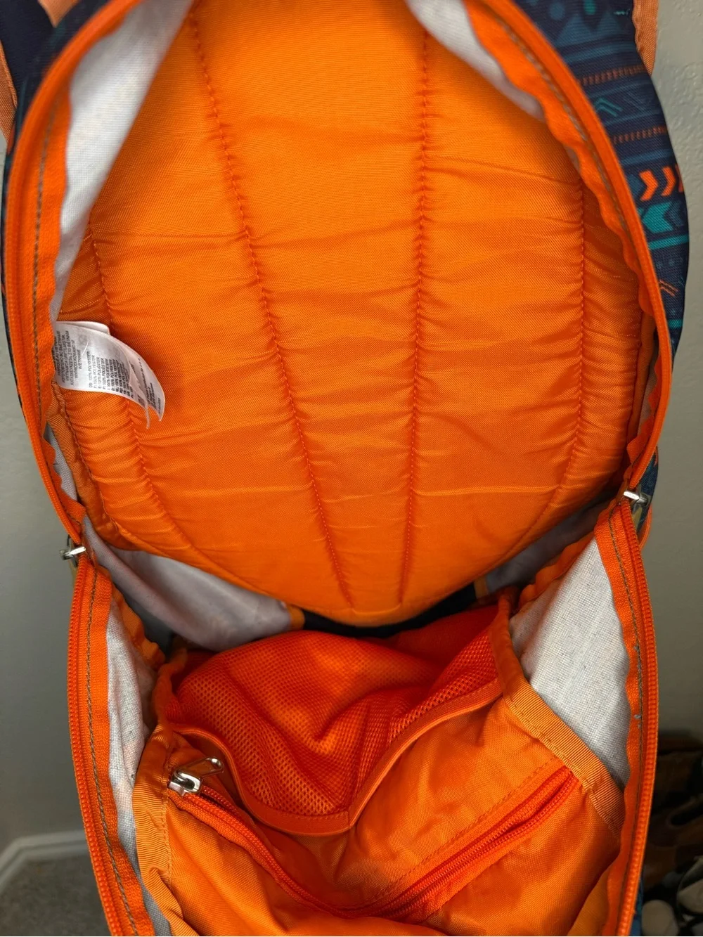 The North Face Navy Backpack with Teal & Orange Accents